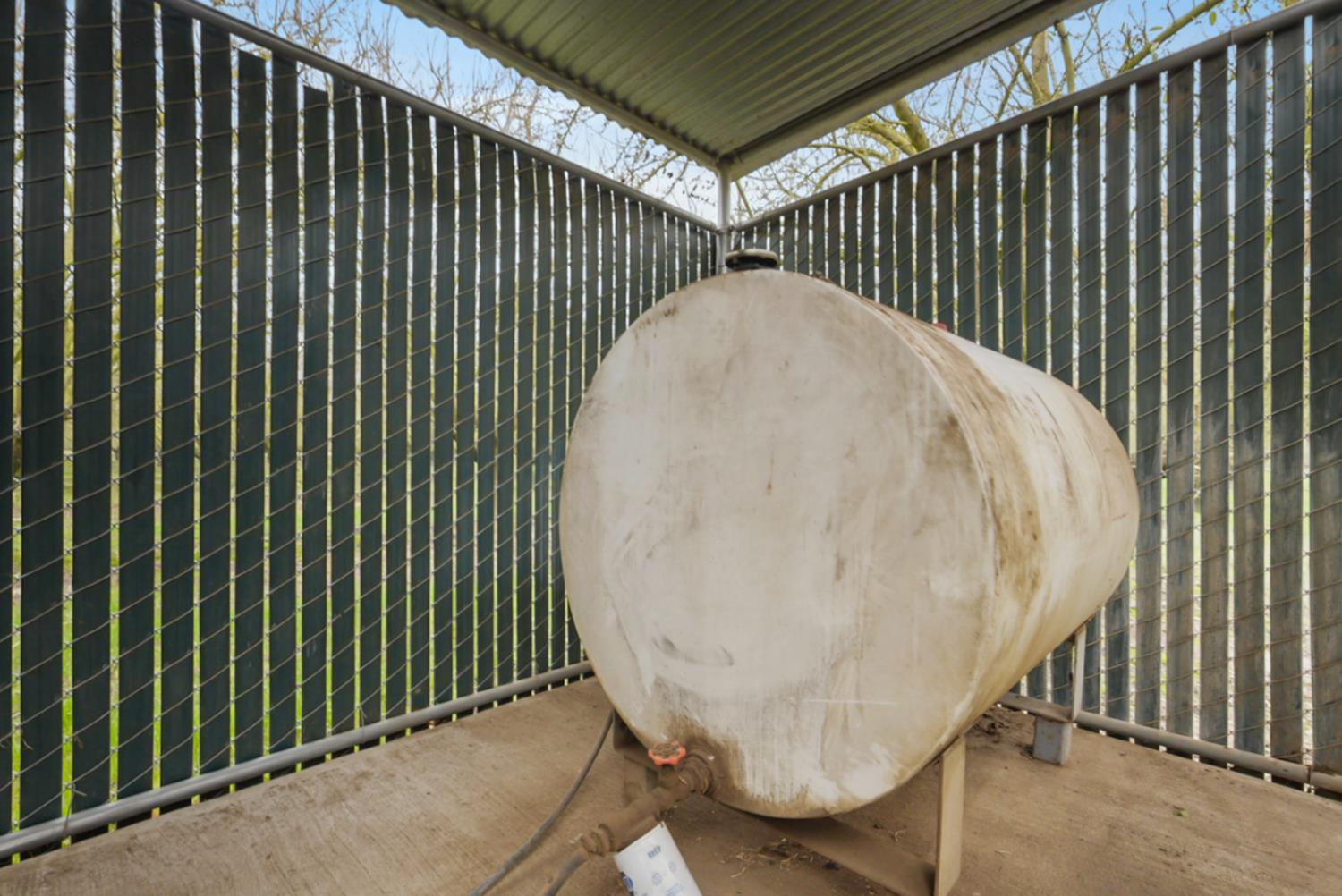 16221 Carrolton Road Escalon, CA 95320 - Photo 43 of 48 a view of a backyard with a wooden fence