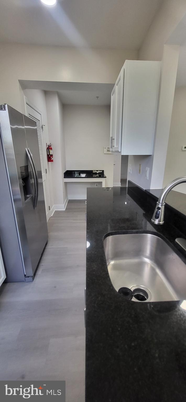 1108 Columbia Road Northwest, Unit 202 Washington, DC 20009 - Photo 7 of 19 a kitchen with a sink and a stove top oven