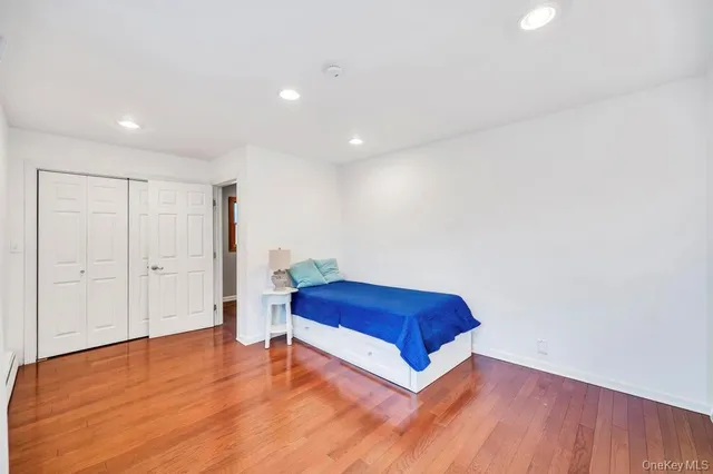 a living room with hard wood floors and a wooden floor