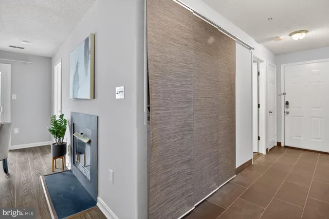 a view of livingroom with hardwood floor and hallway