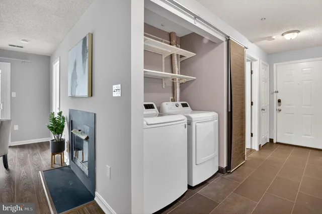 a view of hallway with washer and dryer