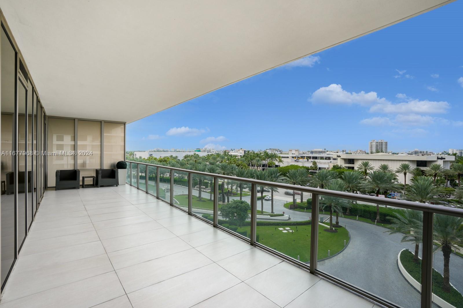 9705 Collins Avenue, Unit 501N Bal Harbour, FL 33154 - Photo 22 of 30 a view of balcony with furniture
