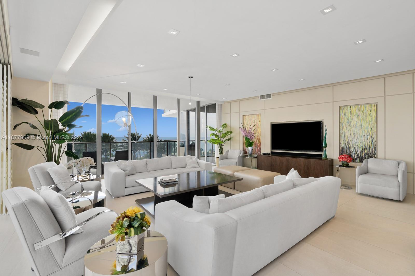 9705 Collins Avenue, Unit 501N Bal Harbour, FL 33154 - Photo 3 of 30 a living room with furniture and a flat screen tv