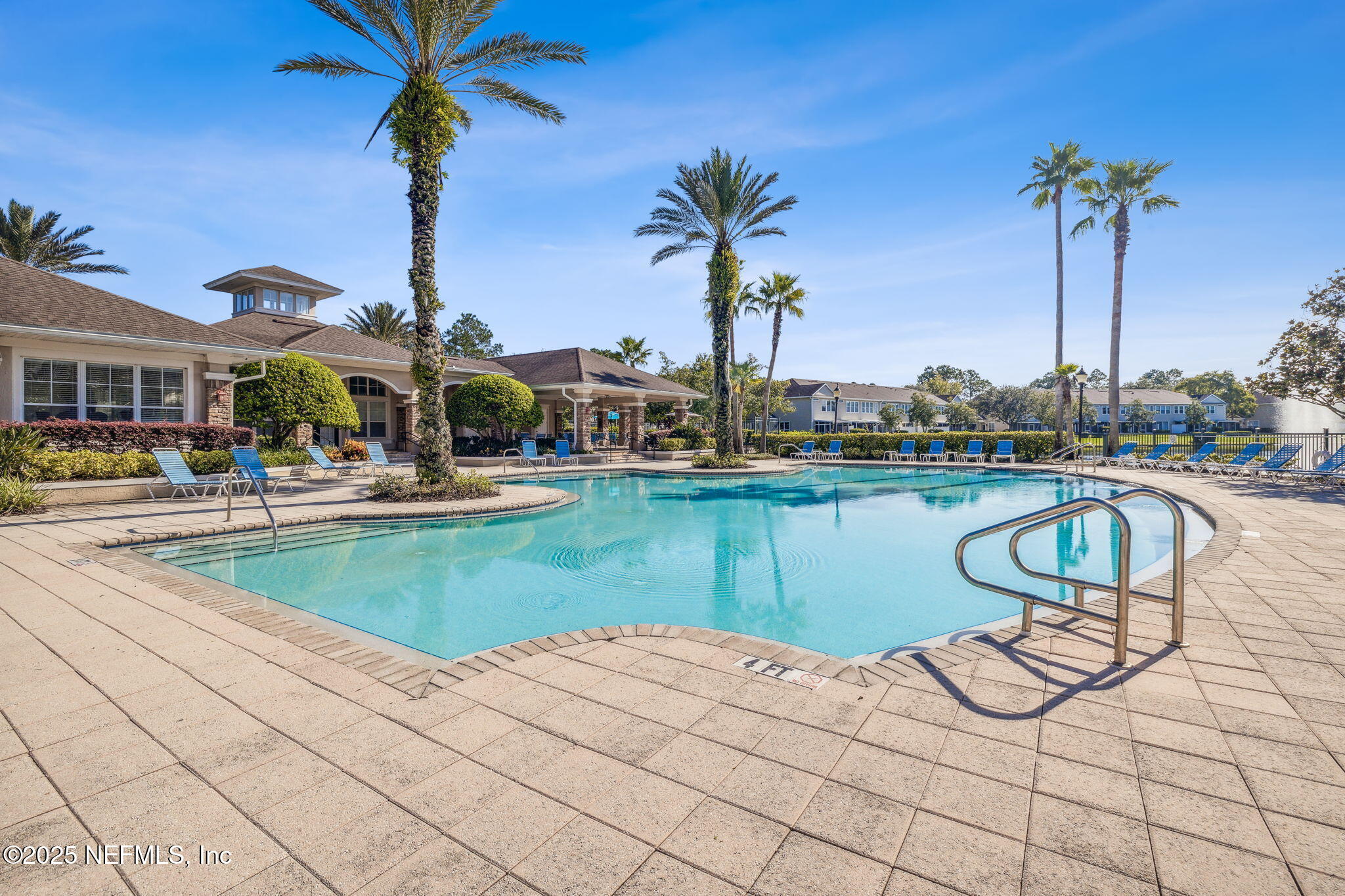 7990 Baymeadows Road East, Unit 2202 Jacksonville, FL 32256 - Photo 12 of 39 a view of a lake with a table and chairs