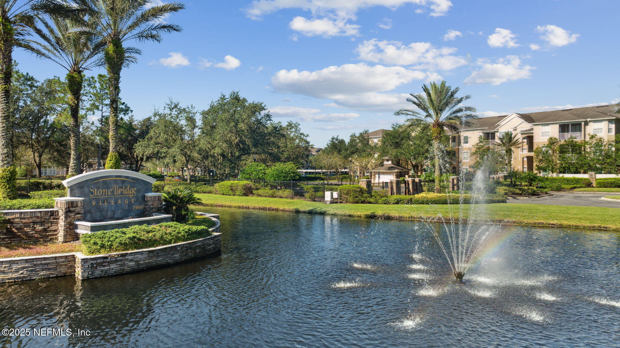7990 Baymeadows Road East, Unit 2202 Jacksonville, FL 32256 - Photo 15 of 39 a view of a swimming pool with a patio and a yard