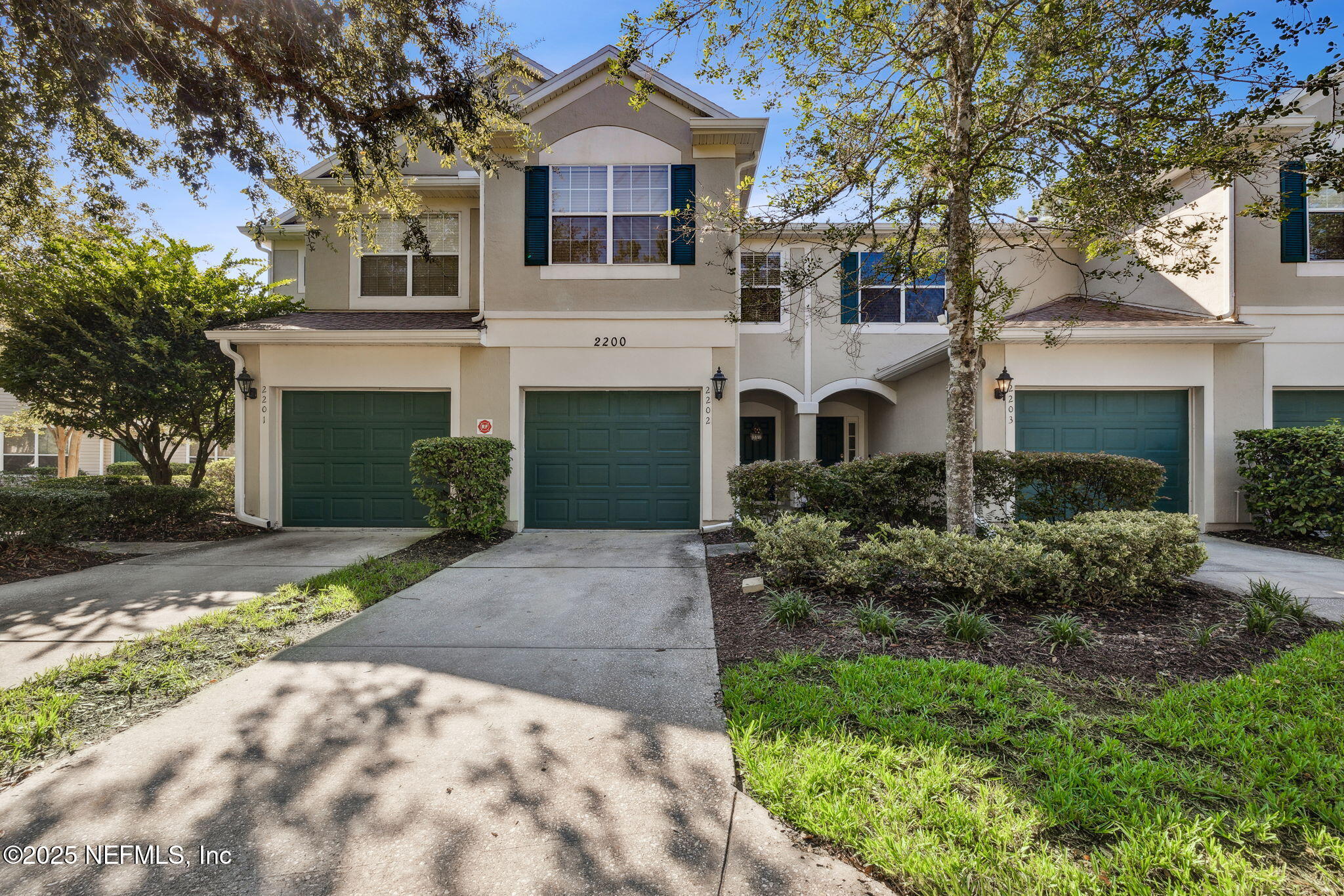 7990 Baymeadows Road East, Unit 2202 Jacksonville, FL 32256 - Photo 19 of 39 a front view of a house with a garden