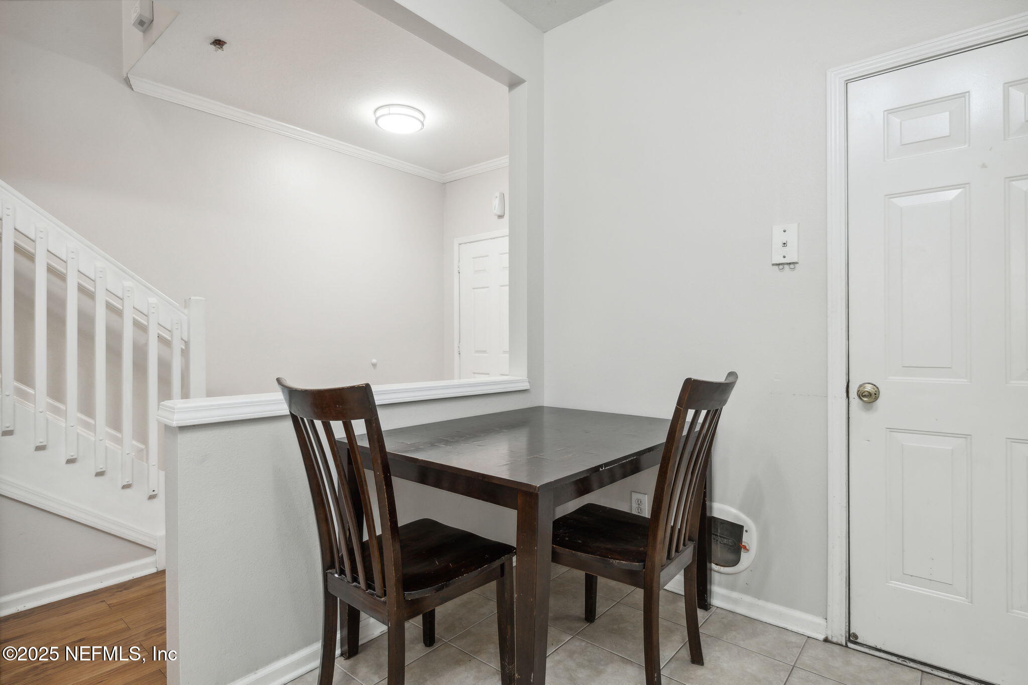 7990 Baymeadows Road East, Unit 2202 Jacksonville, FL 32256 - Photo 30 of 39 a view of a dining room with furniture and wooden floor