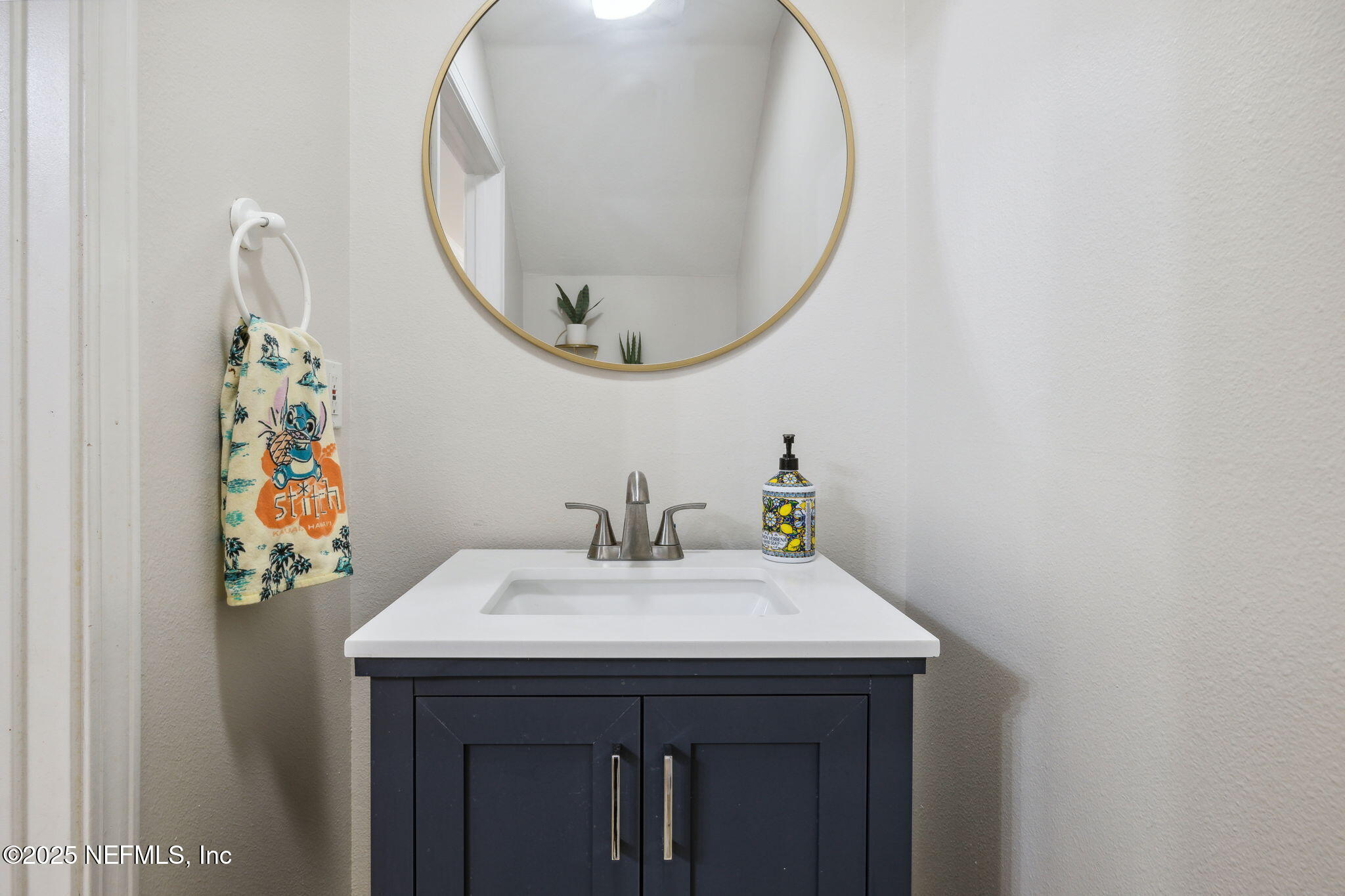 7990 Baymeadows Road East, Unit 2202 Jacksonville, FL 32256 - Photo 31 of 39 a bathroom with a sink and a mirror