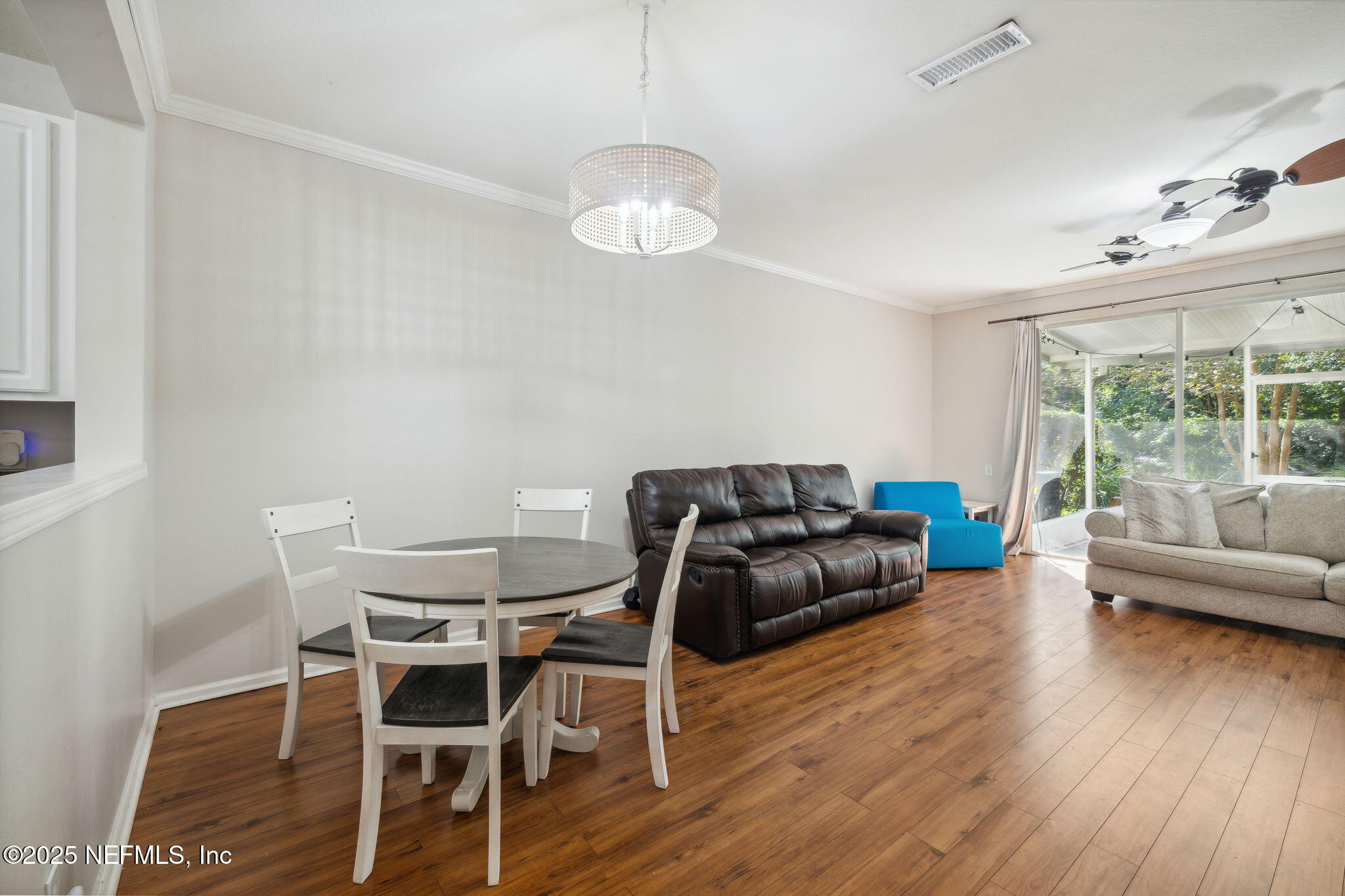 7990 Baymeadows Road East, Unit 2202 Jacksonville, FL 32256 - Photo 4 of 39 a living room with furniture and a large window