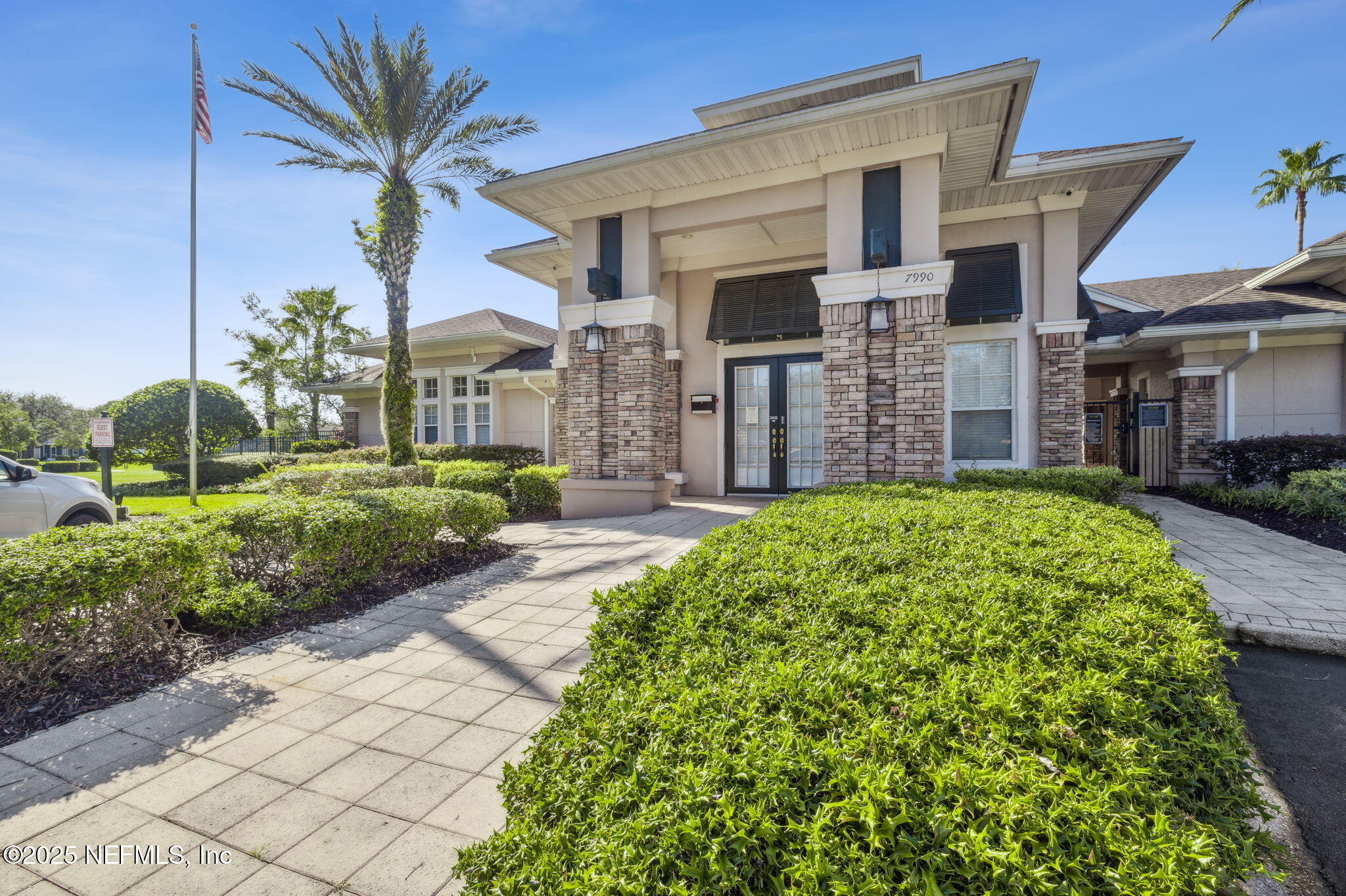 7990 Baymeadows Road East, Unit 2202 Jacksonville, FL 32256 - Photo 10 of 39 a front view of a house with a garden