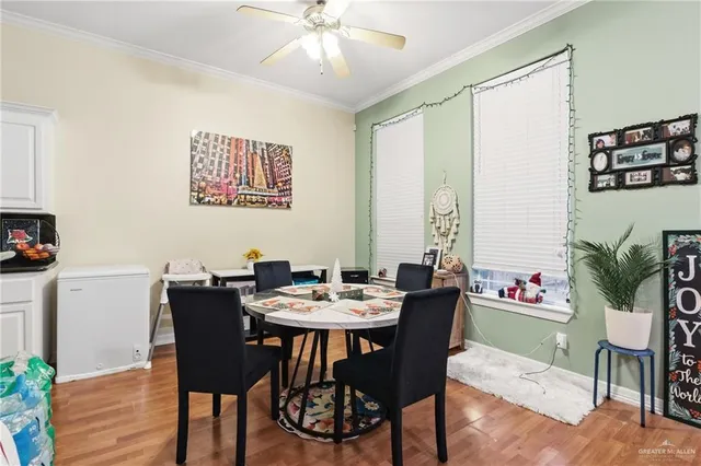 a view of a patio with a table and chairs