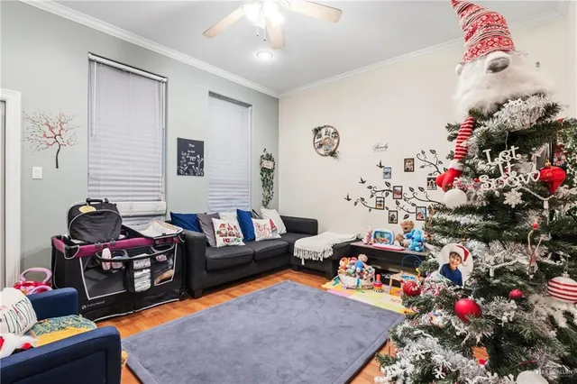 a living room with furniture and a dining table