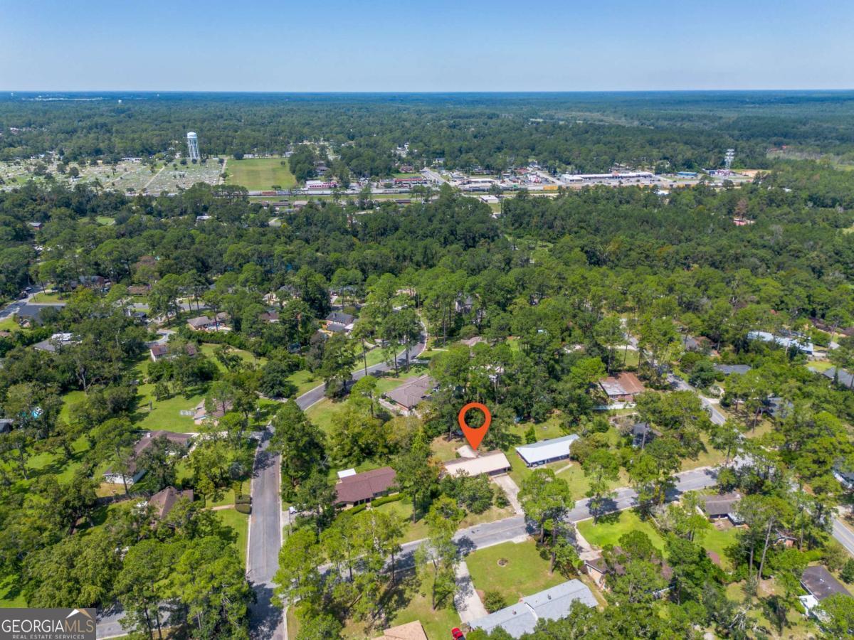 1703 Rainbow Drive Waycross, GA 31501 - Photo 19 of 19 an aerial view of residential houses with outdoor space and trees