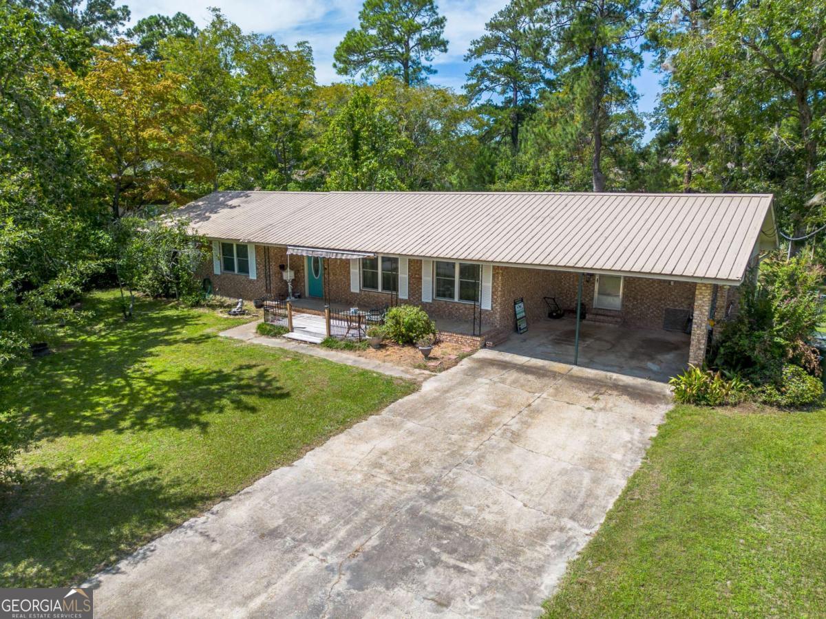 1703 Rainbow Drive Waycross, GA 31501 - Photo 2 of 19 a view of a patio with a yard