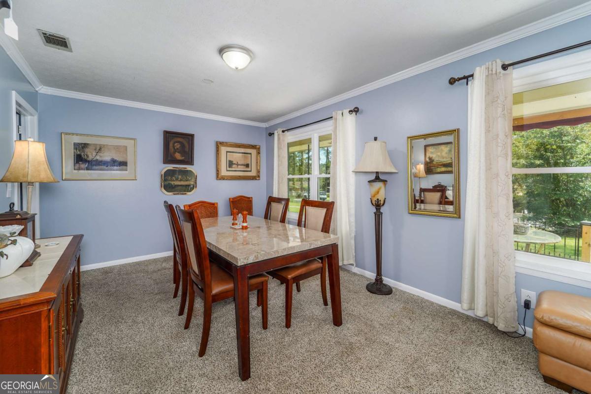1703 Rainbow Drive Waycross, GA 31501 - Photo 4 of 19 a view of a dining room with furniture