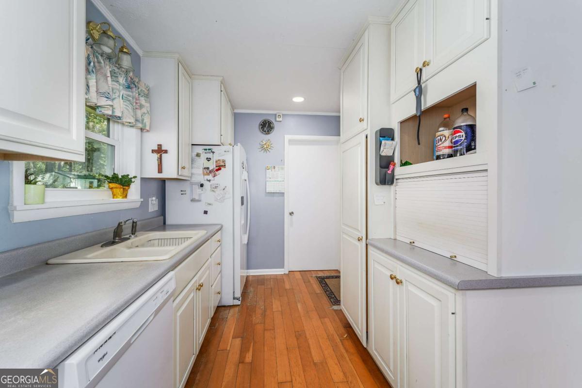1703 Rainbow Drive Waycross, GA 31501 - Photo 8 of 19 a spacious bathroom with a granite countertop double vanity sink a mirror and a shower