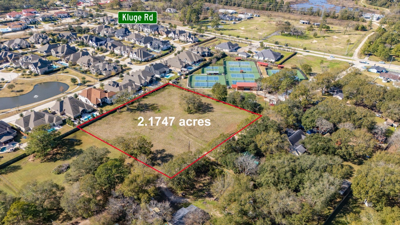 12537 Kluge Road Cypress, TX 77429 - Photo 6 of 12 a view of a street with a building in the background