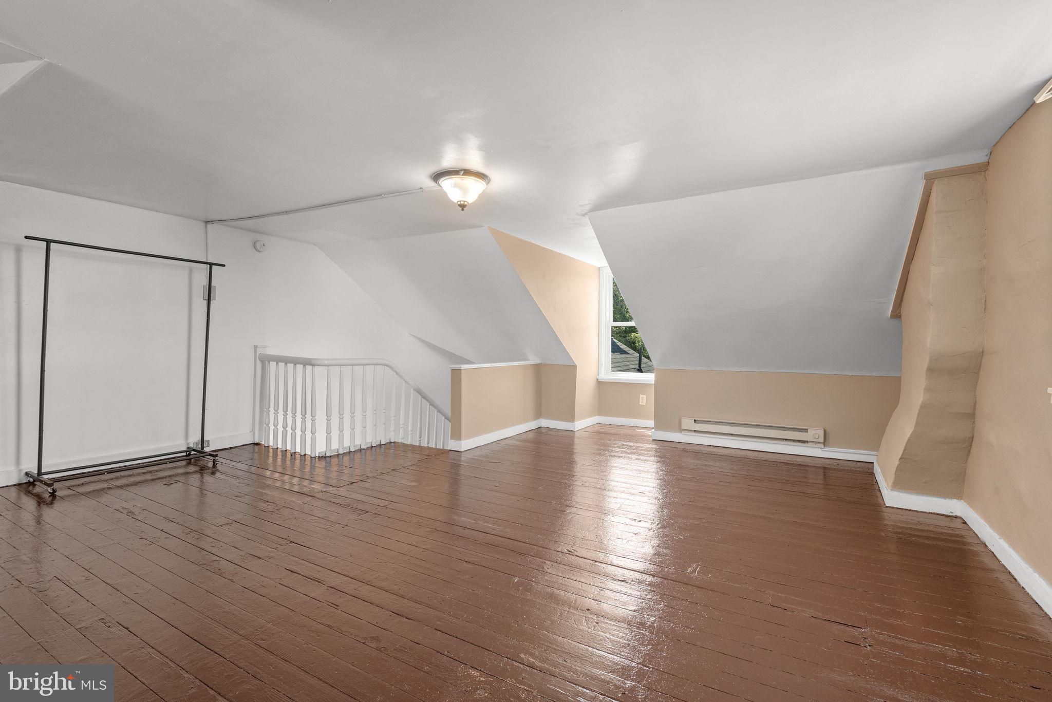 126 North Queen Street York, PA 17403 - Photo 24 of 33 a view of an empty room with wooden floor and a window