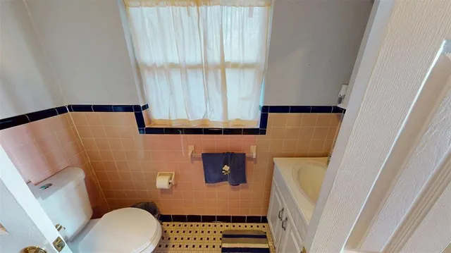 a bathroom with a toilet and a sink