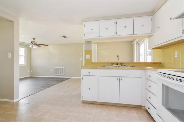 a bathroom with a sink vanity and a mirror