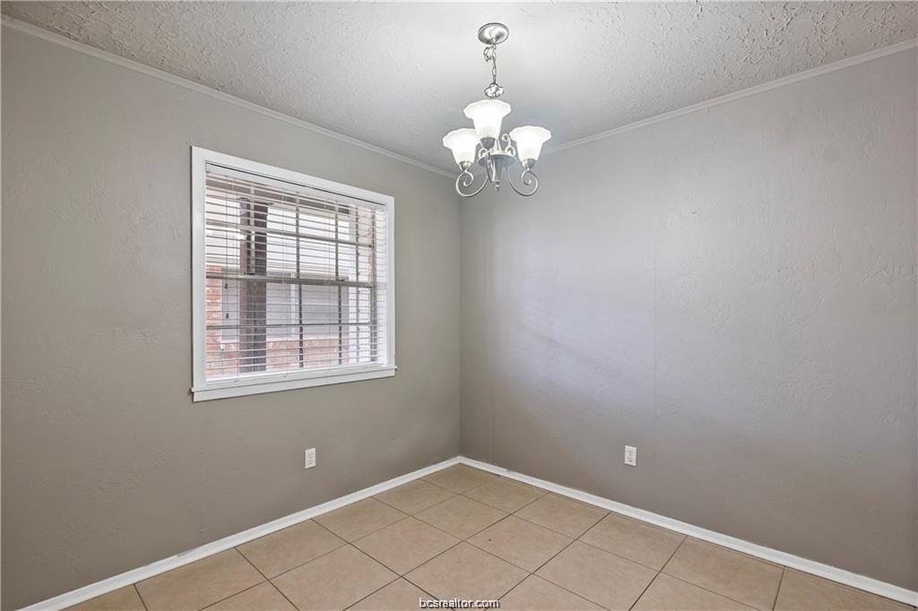 3906 Aspen Street, Unit B Bryan, TX 77801 - Photo 6 of 13 en view of an empty room with a window