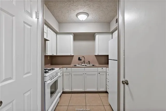 a kitchen with stainless steel appliances a stove and a refrigerator