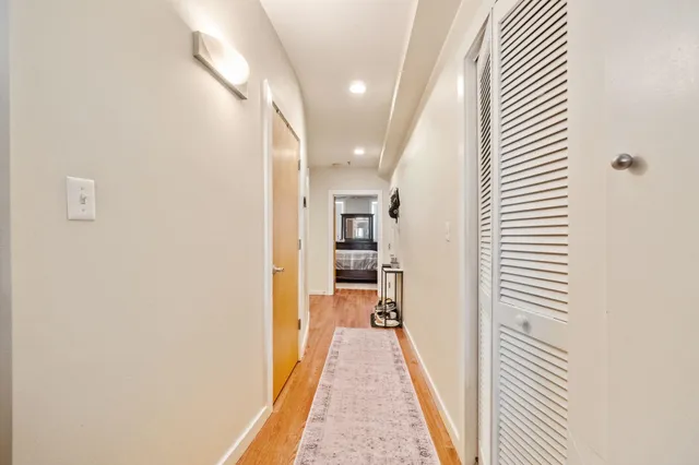 a view of a hallway with a white walls