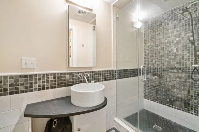 a bathroom with a sink and a mirror