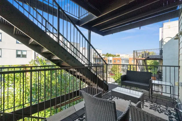 a view of balcony with furniture