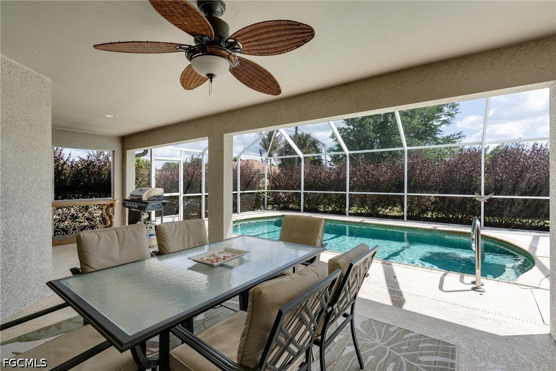 3801 28th Street Southwest Lehigh Acres, FL 33976 - Photo 22 of 37 a view of a dining room with furniture wooden floor and chandelier