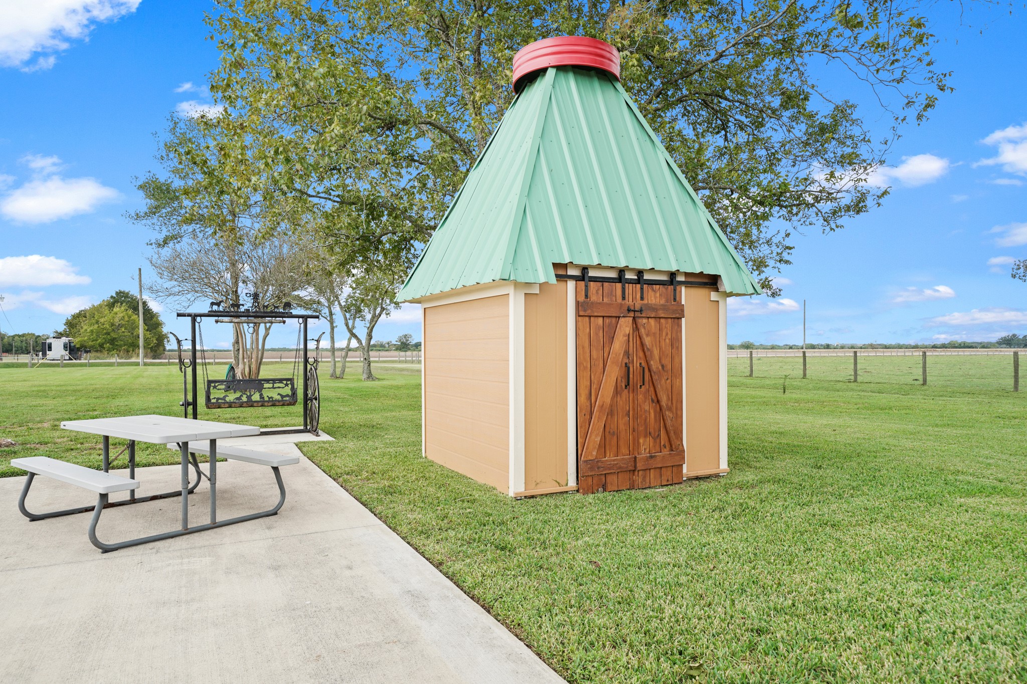 10507 Padon Road Needville, TX 77461 - Photo 14 of 48 a view of backyard with a garden and entertaining space