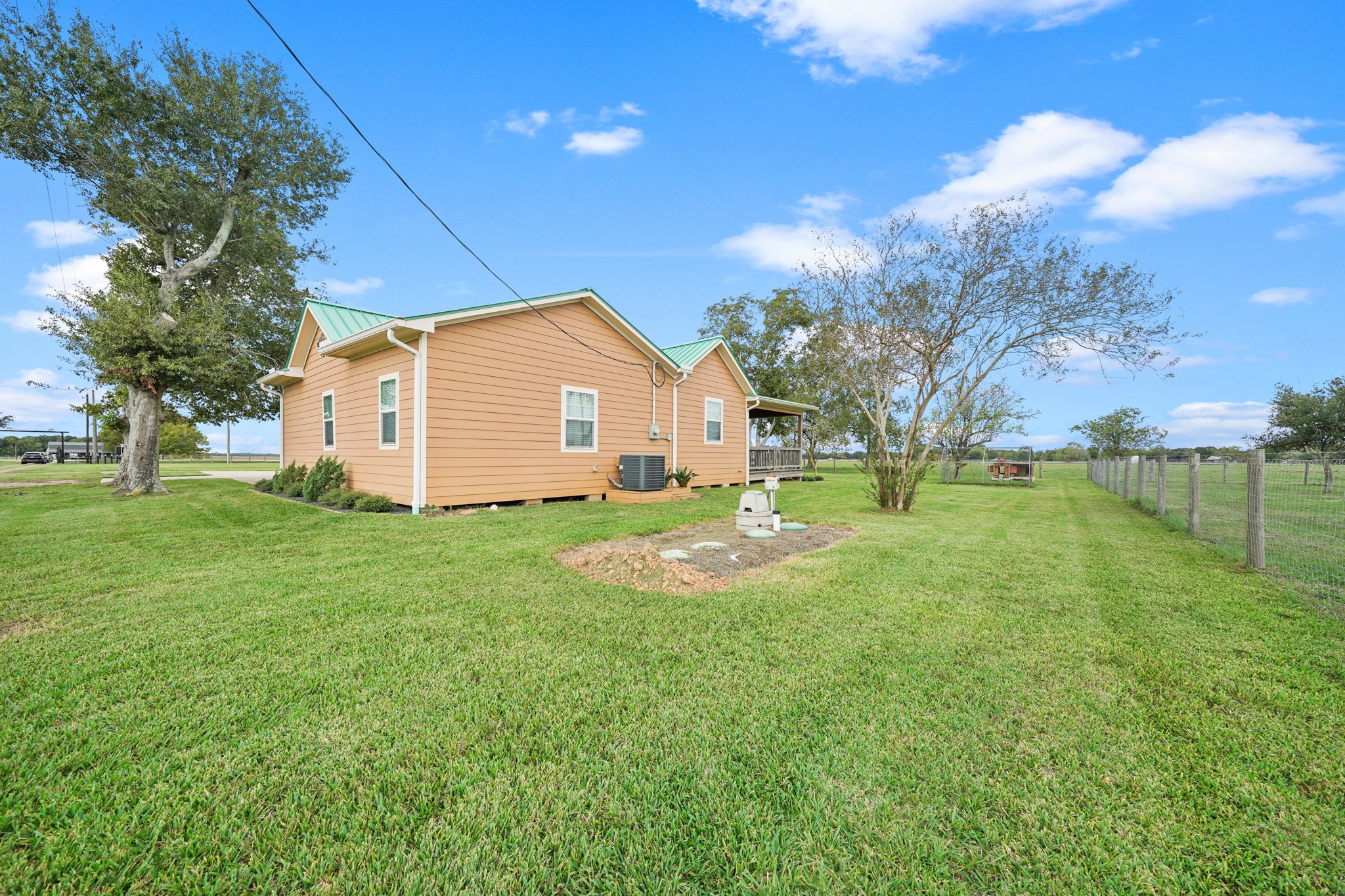 10507 Padon Road Needville, TX 77461 - Photo 16 of 48 a view of a house with backyard and tree s