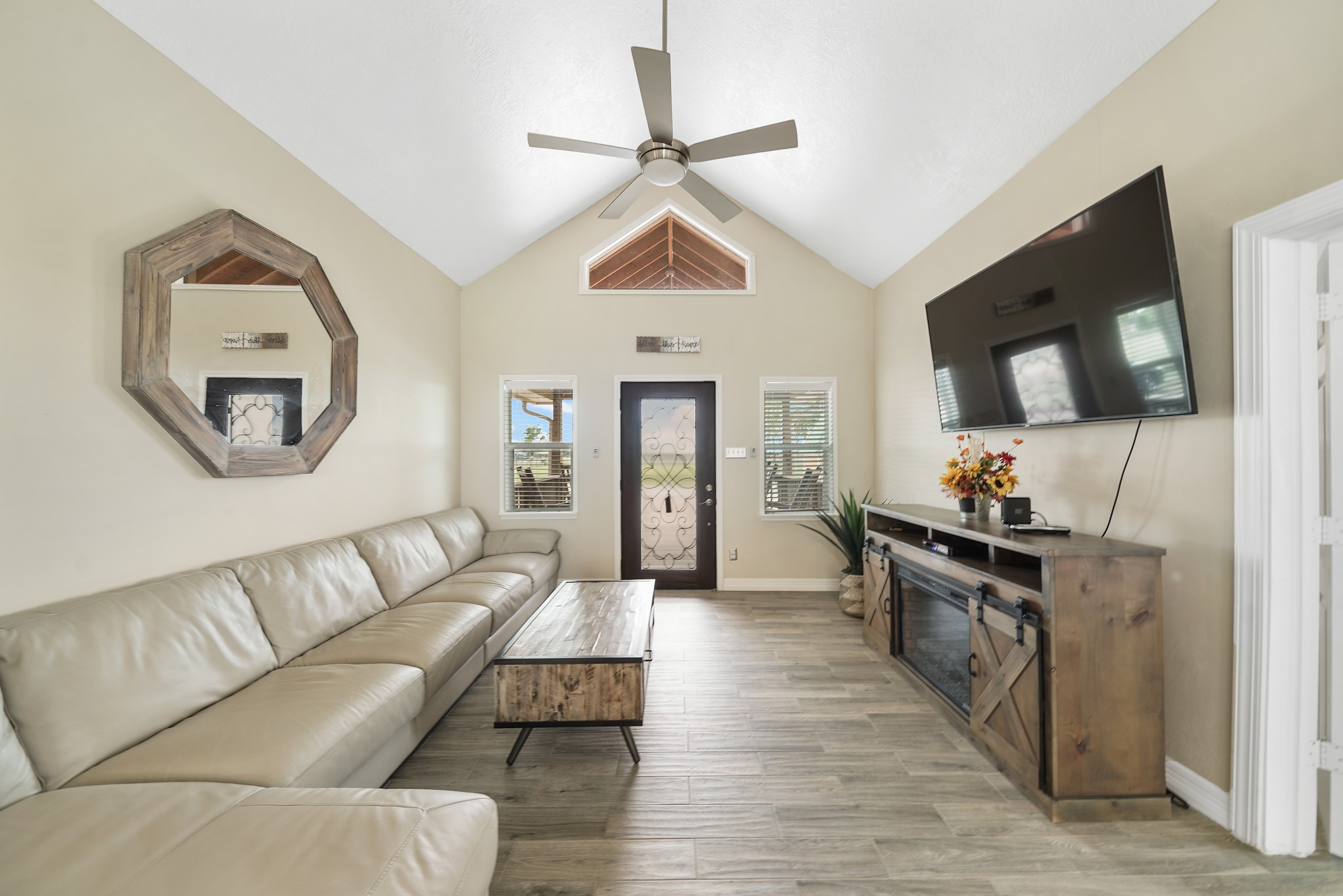 10507 Padon Road Needville, TX 77461 - Photo 25 of 48 a living room with furniture a flat screen tv and a dresser
