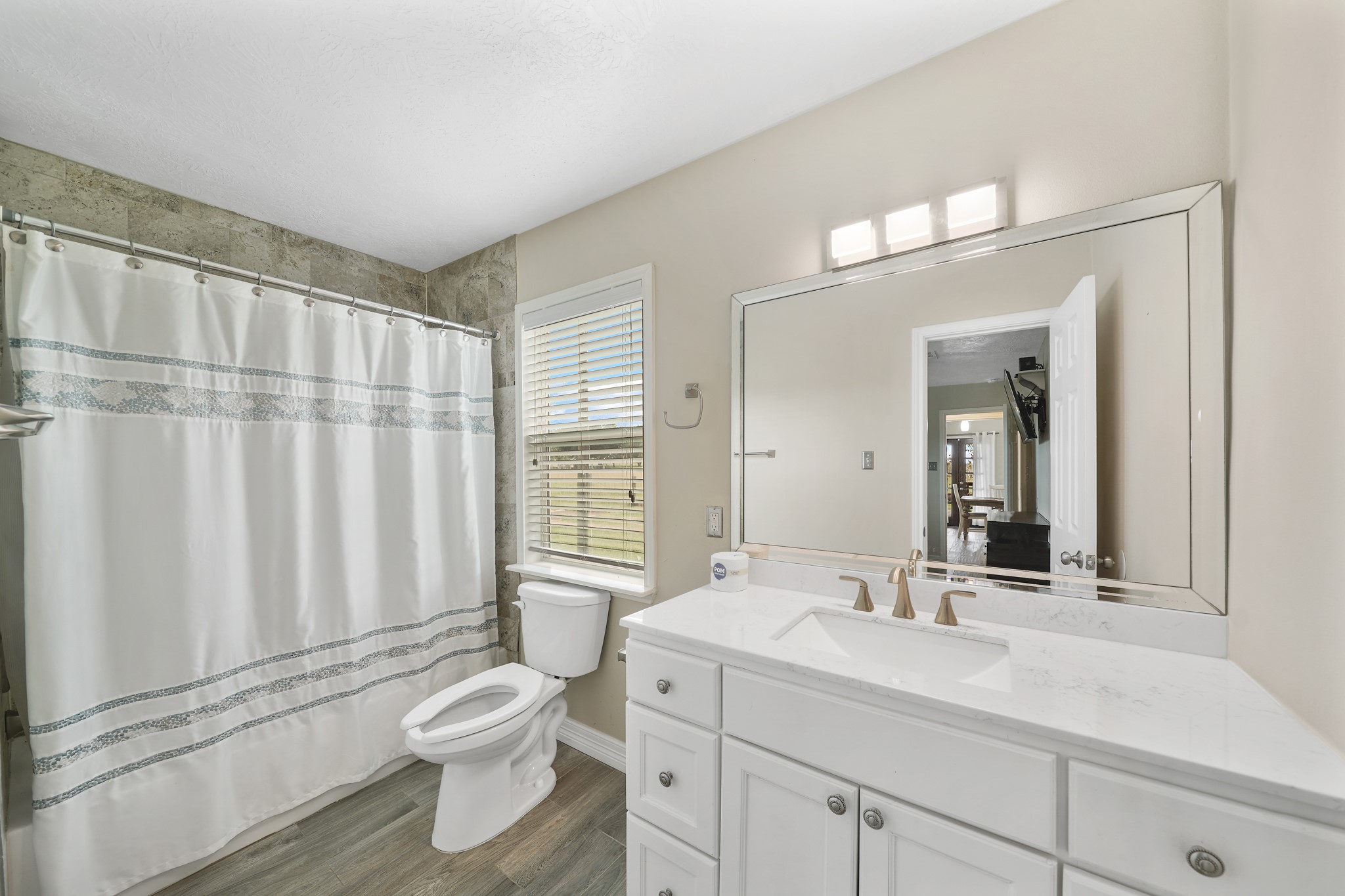 10507 Padon Road Needville, TX 77461 - Photo 33 of 48 a bathroom with a toilet sink and mirror