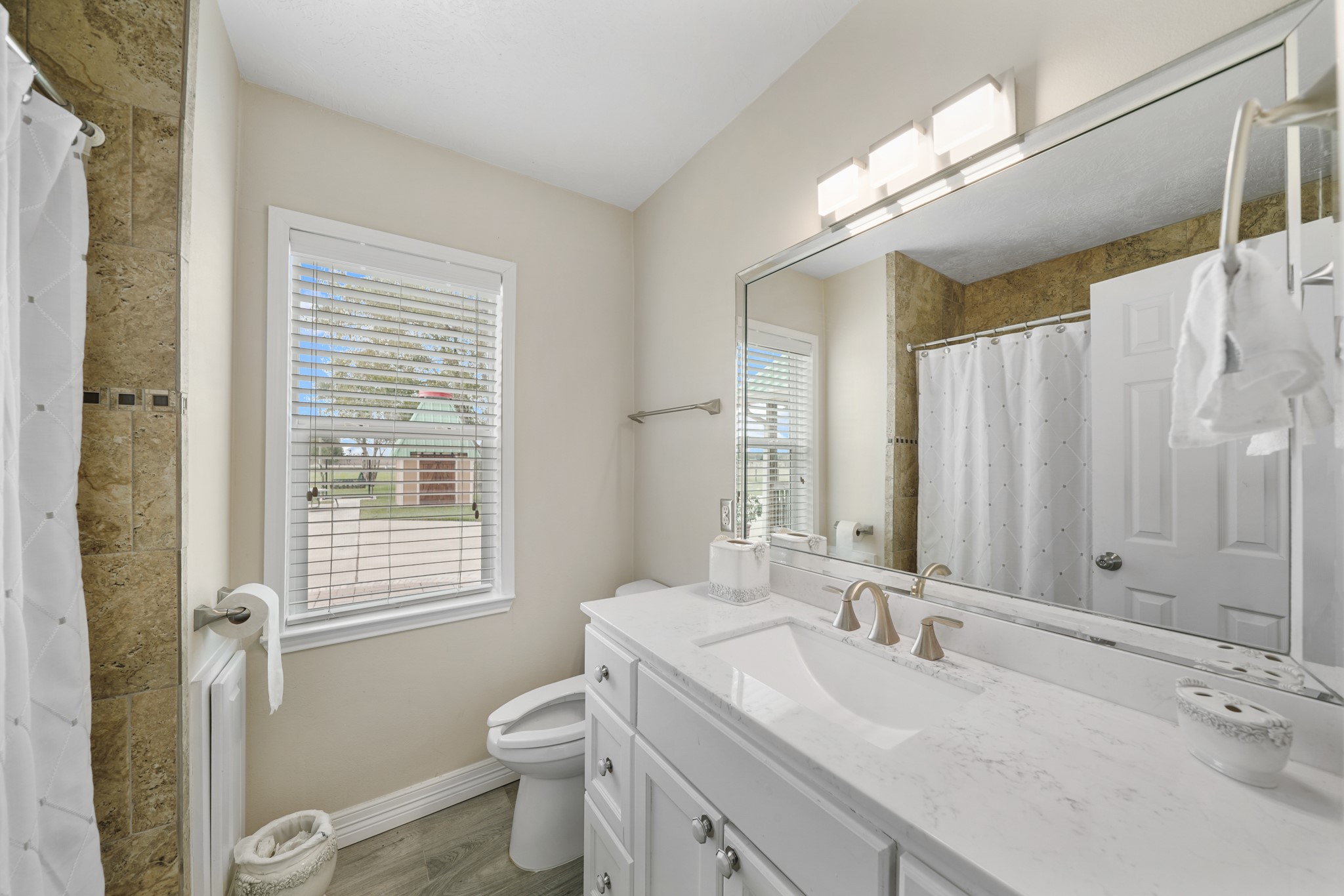10507 Padon Road Needville, TX 77461 - Photo 36 of 48 a bathroom with a double vanity sink toilet and shower