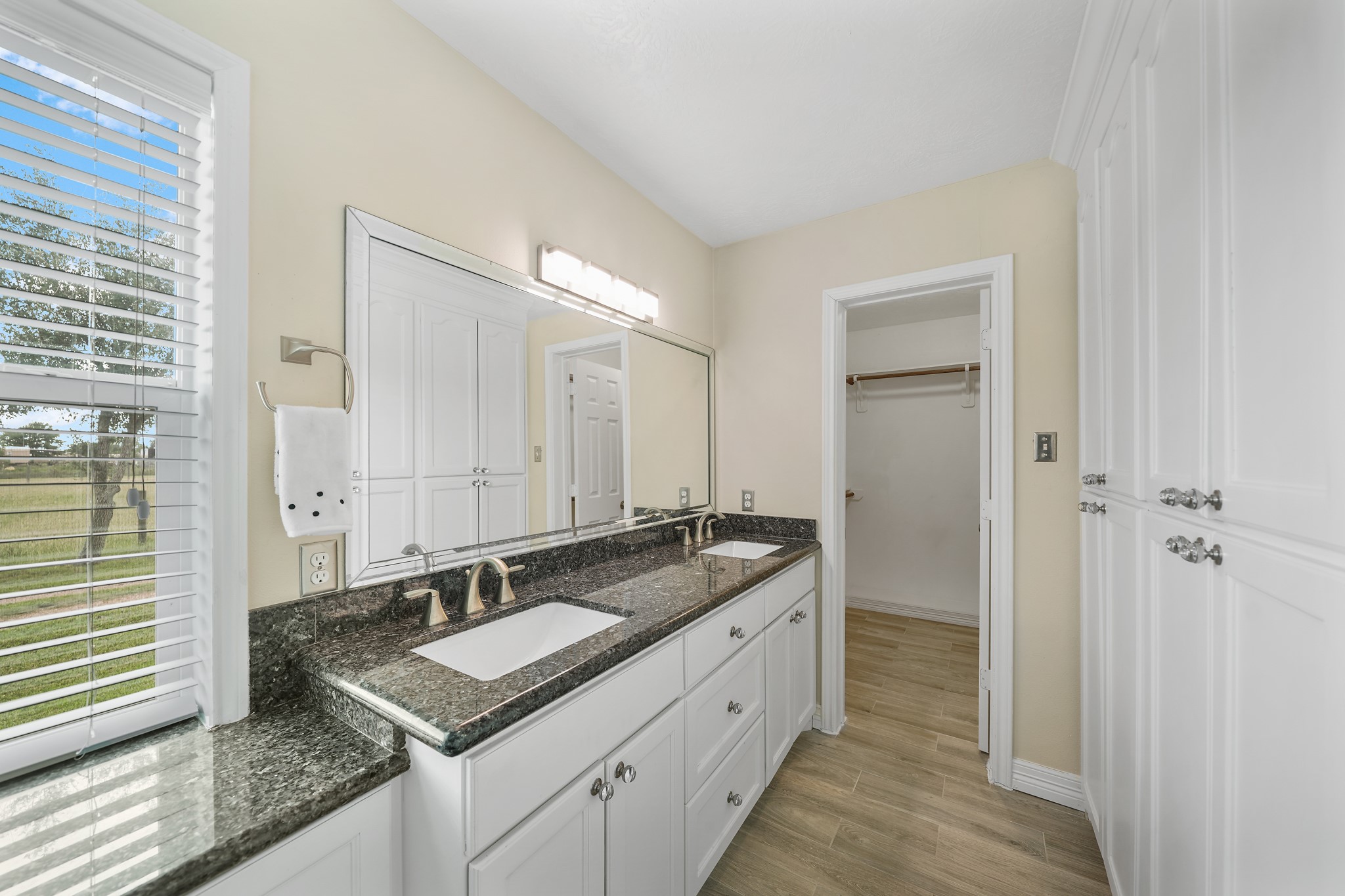 10507 Padon Road Needville, TX 77461 - Photo 38 of 48 a bathroom with a granite countertop sink and a mirror