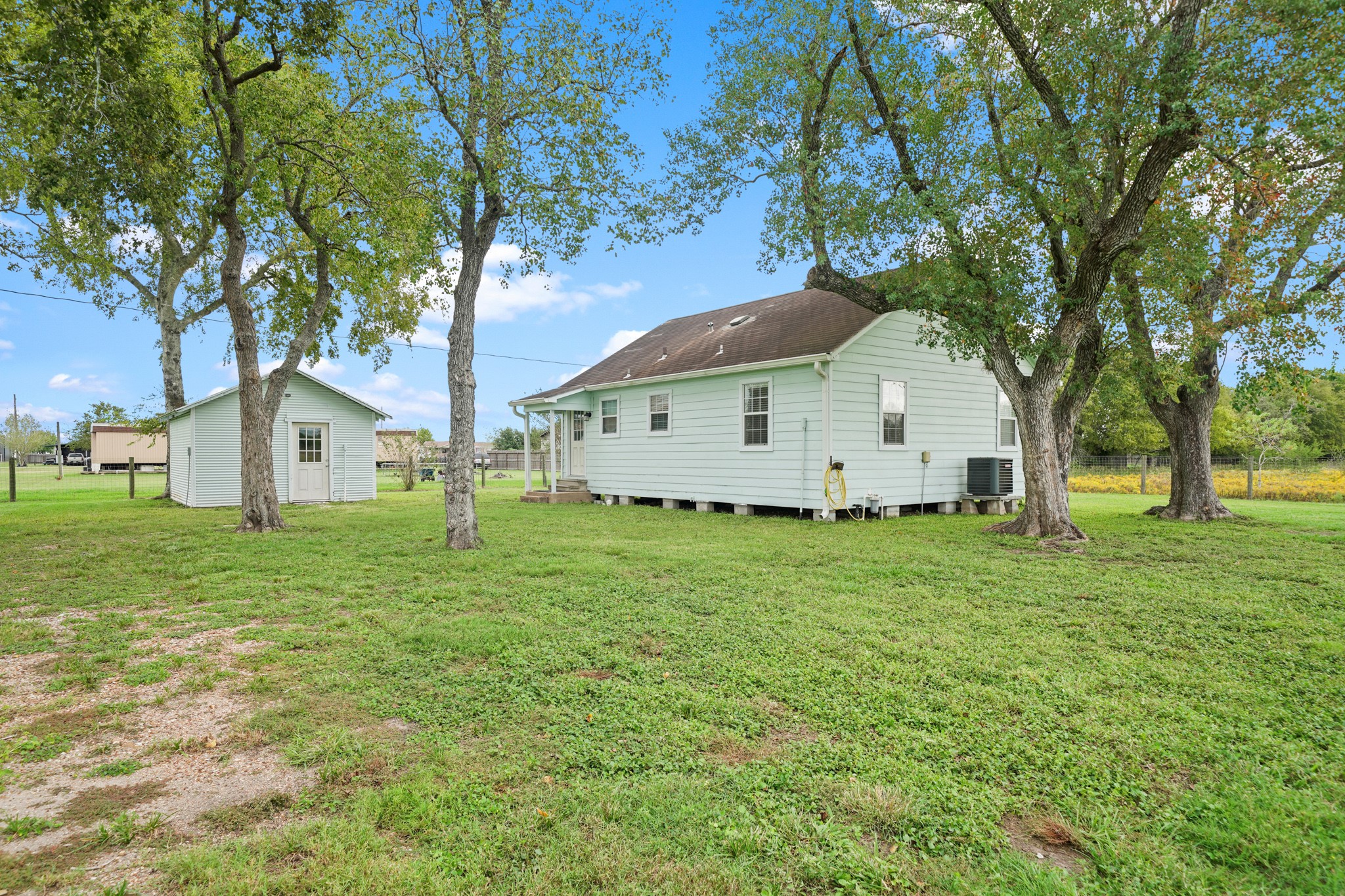 10507 Padon Road Needville, TX 77461 - Photo 43 of 48 a view of a house with a yard