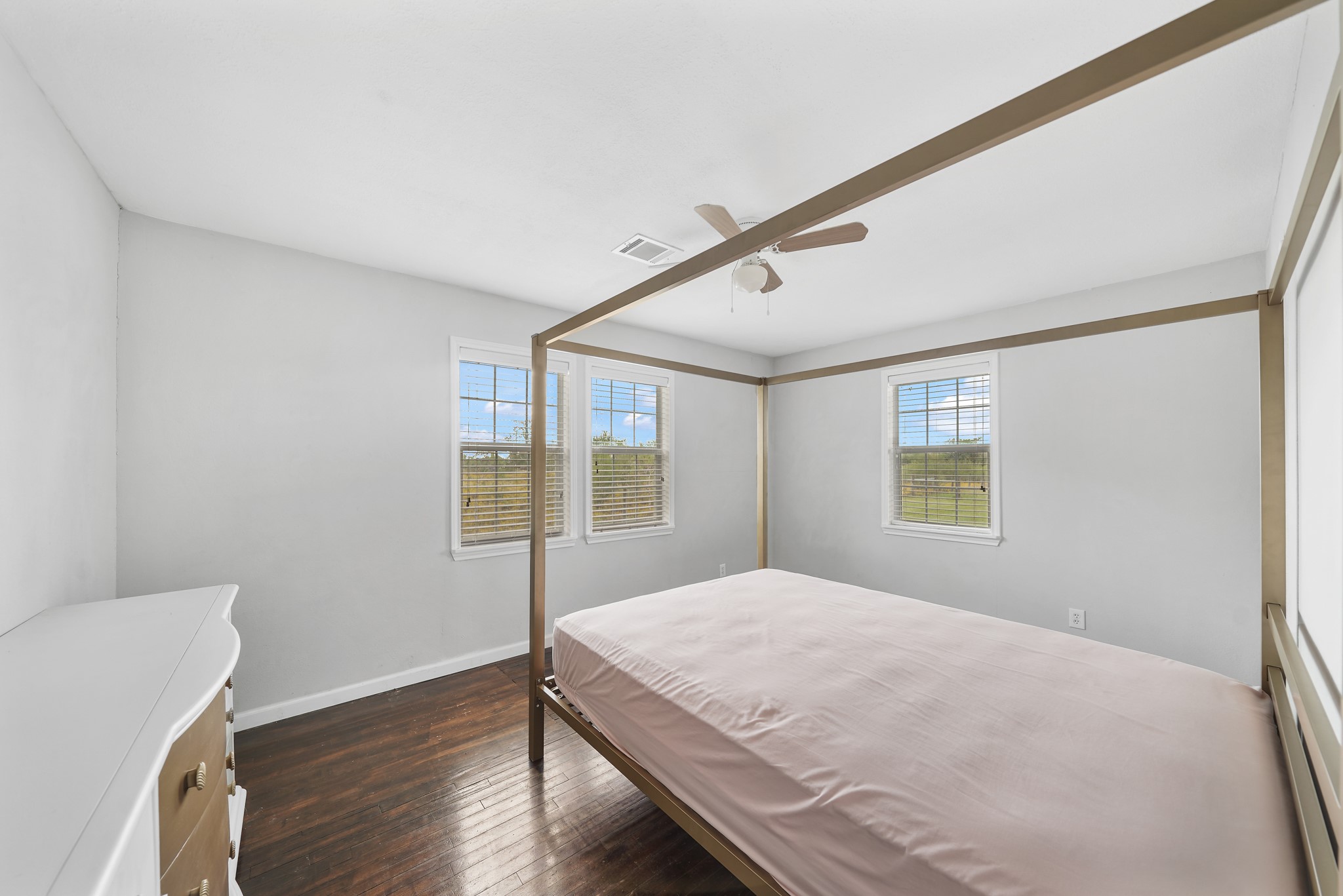 10507 Padon Road Needville, TX 77461 - Photo 45 of 48 a bedroom with a bed and wooden floor