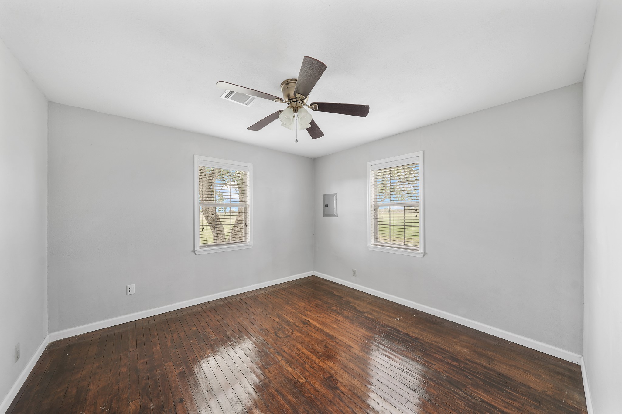 10507 Padon Road Needville, TX 77461 - Photo 46 of 48 a view of a room with wooden floor and ceiling fan