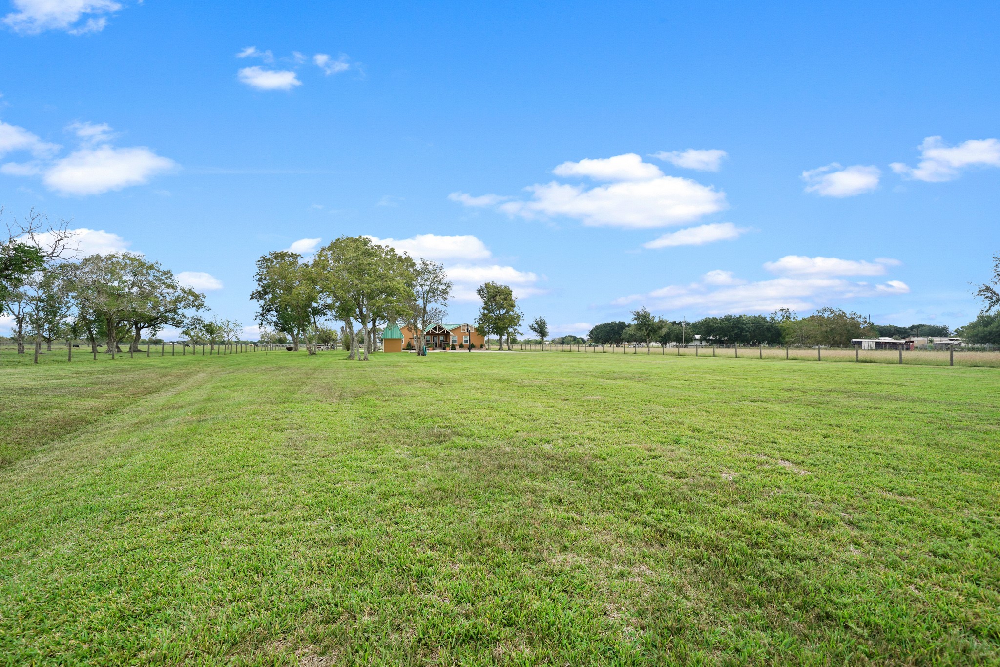 10507 Padon Road Needville, TX 77461 - Photo 7 of 48 a view of a golf course with an trees