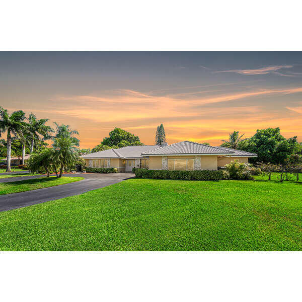 22299 Solitude Drive Boca Raton, FL 33428 - Photo 3 of 38 Twilight Front View