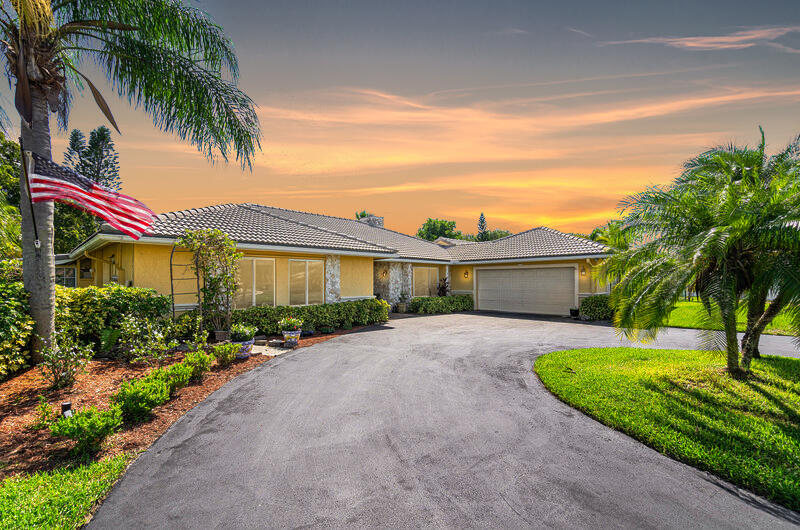 22299 Solitude Drive Boca Raton, FL 33428 - Photo 5 of 38 Twilight Front View