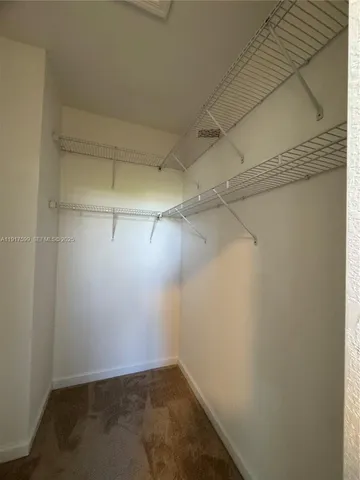 a view of a room with racks on the wall