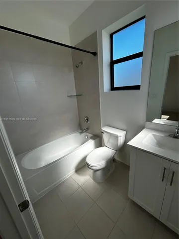 a bathroom with a toilet sink and shower