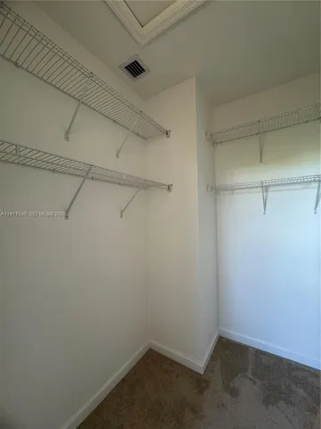 a view of a room with racks on the wall