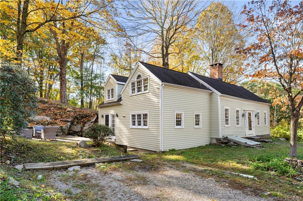 101 Pinetree Road Redding, CT 06896 - Photo 1 of 1 a view of a white house with a large tree and a yard