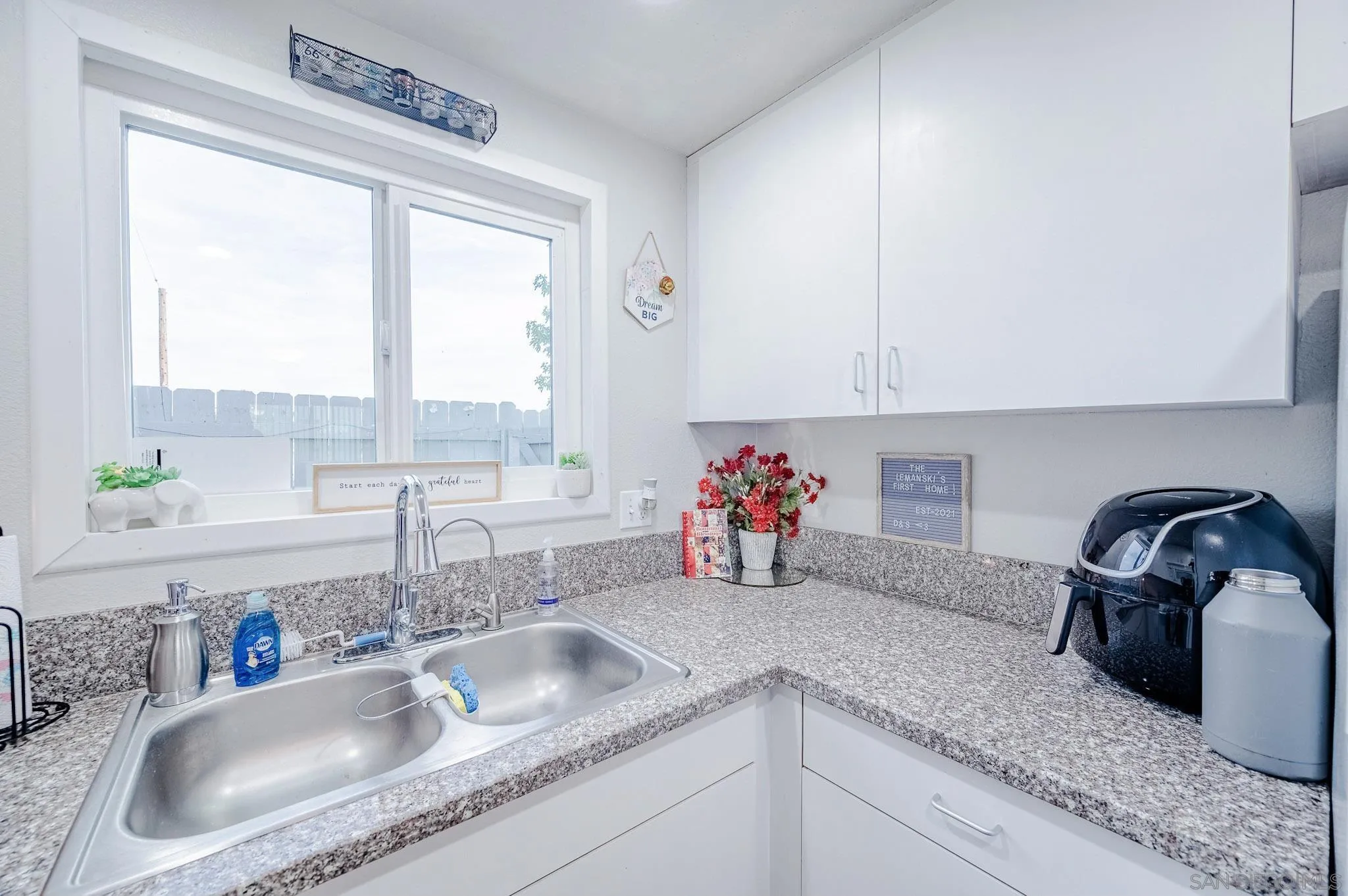 5140 North River Road, Unit F Oceanside, CA 92057 - Photo 23 of 39 a kitchen with granite countertop a sink stove and cabinets