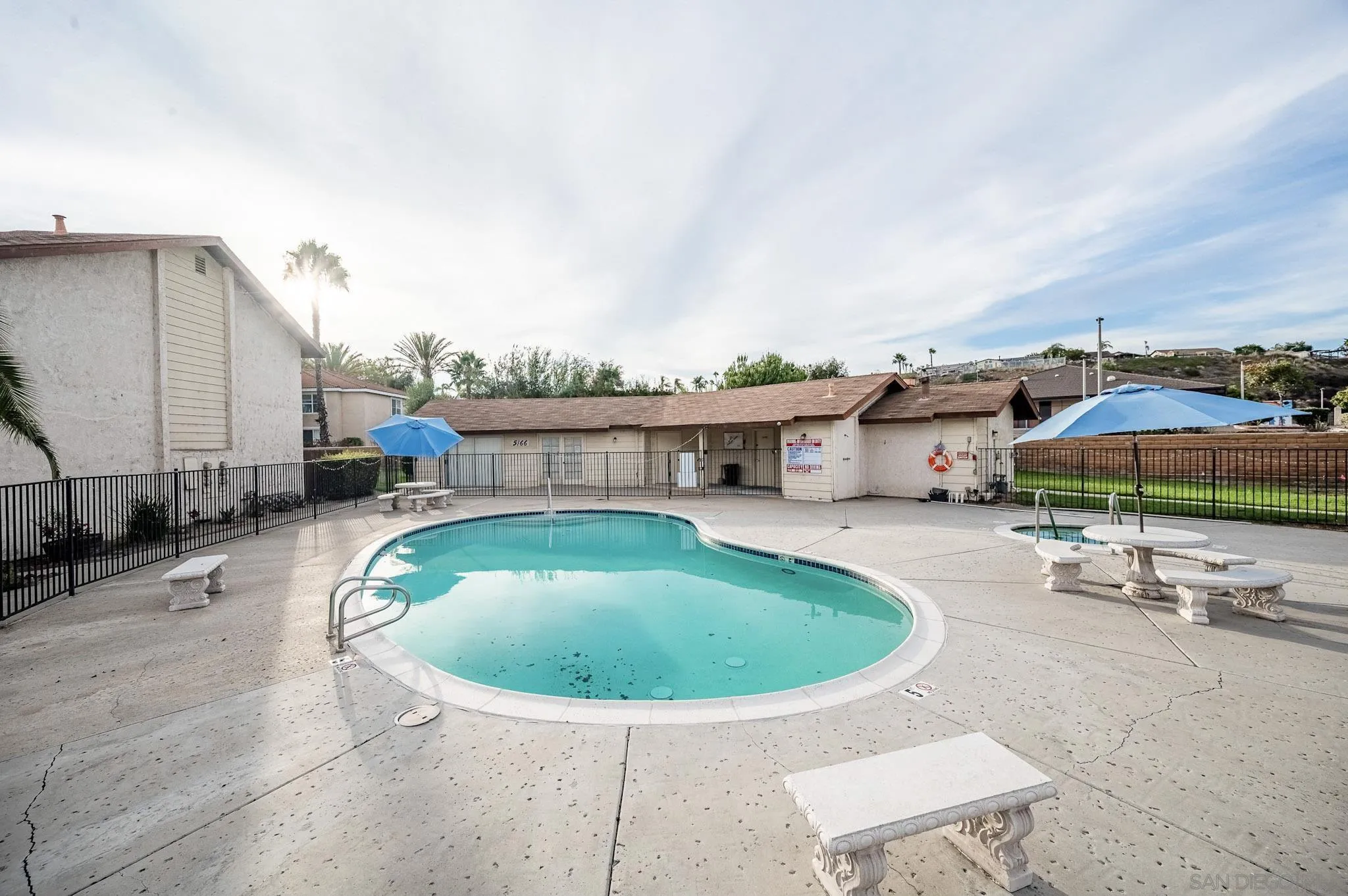 5140 North River Road, Unit F Oceanside, CA 92057 - Photo 39 of 39 a view of a swimming pool with a lounge chair