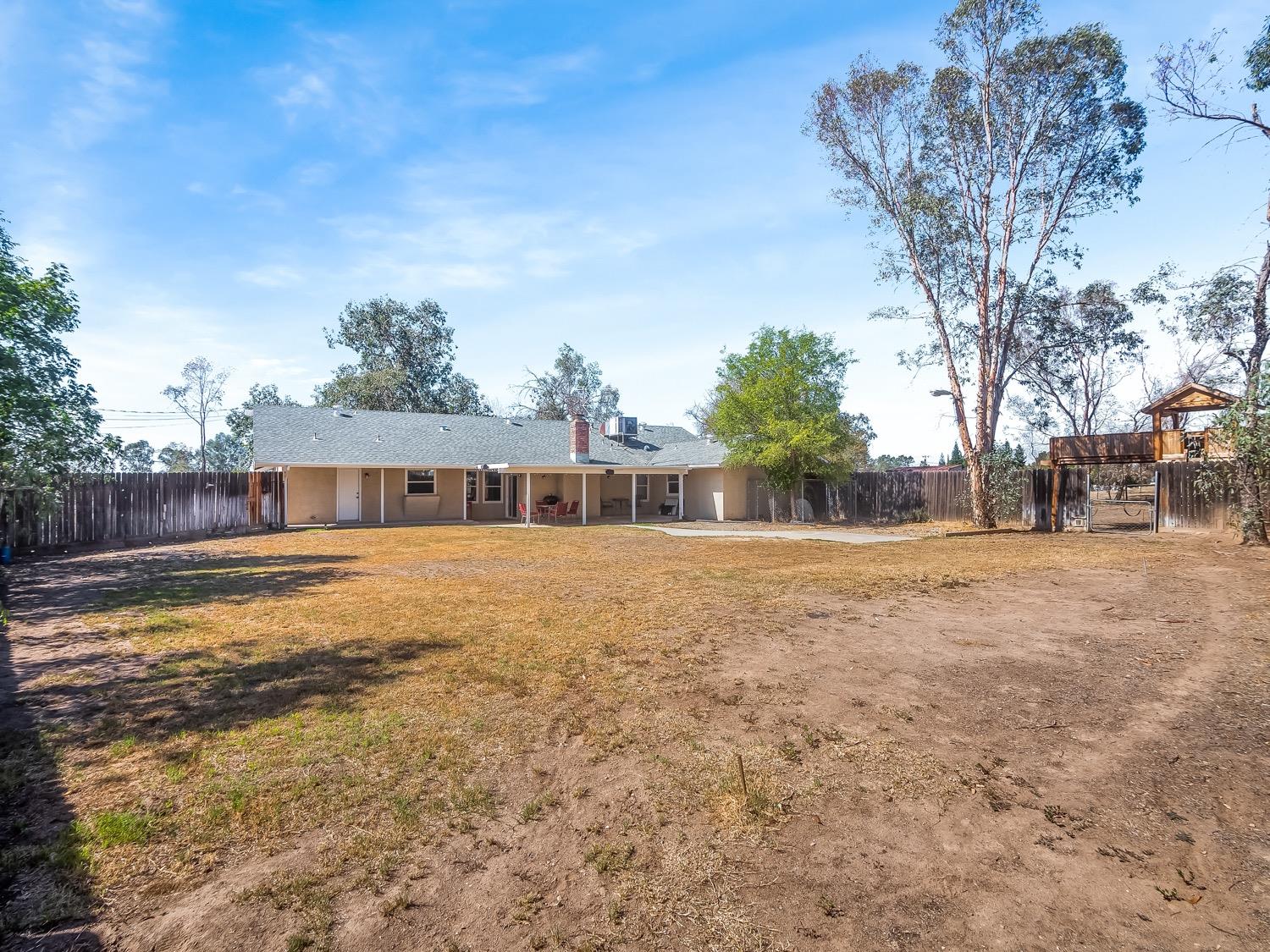 16181 Monreal Road Madera, CA 93636 - Photo 16 of 40 a view of a house with a yard
