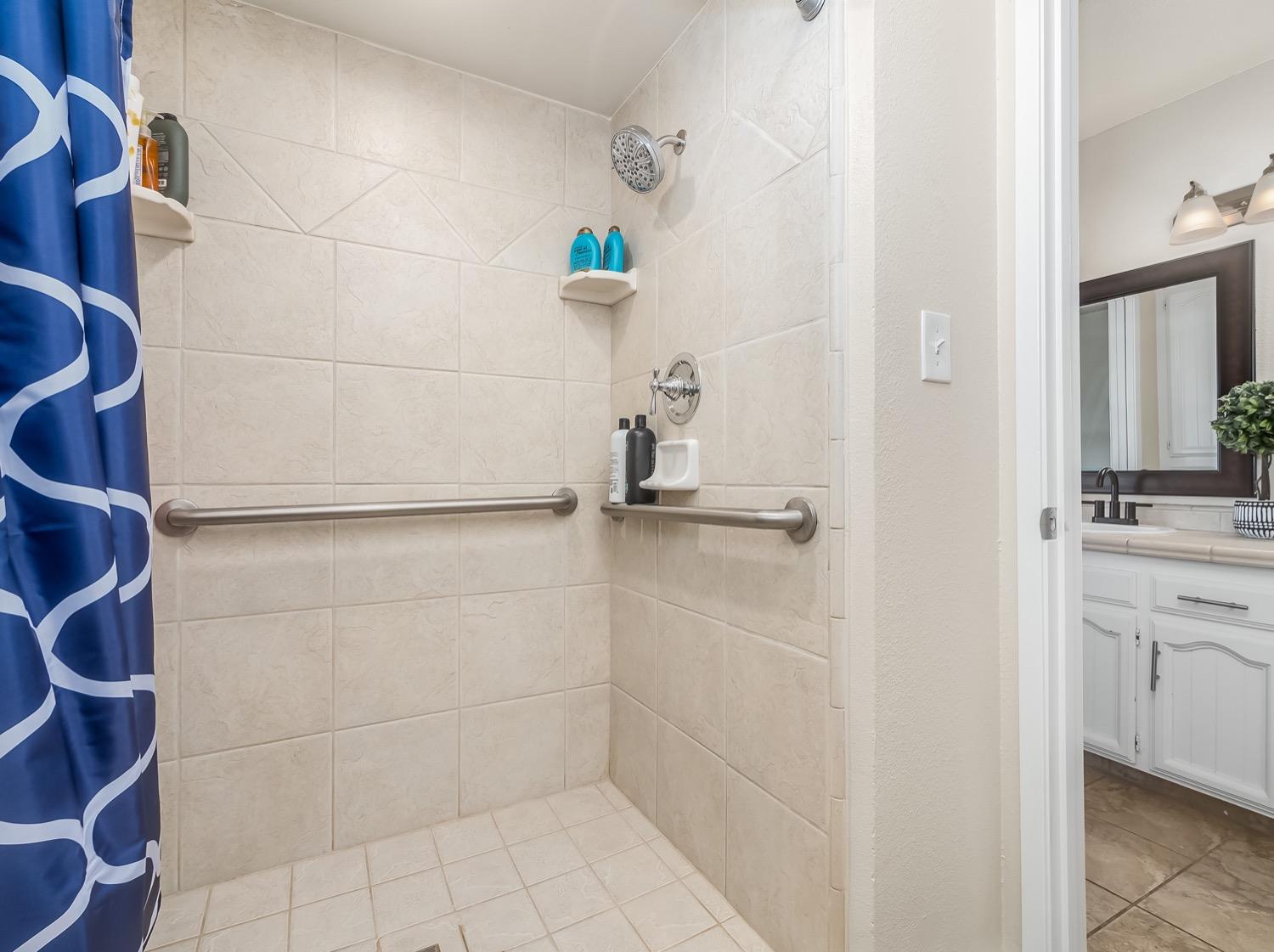 16181 Monreal Road Madera, CA 93636 - Photo 25 of 40 a bathroom with a shower